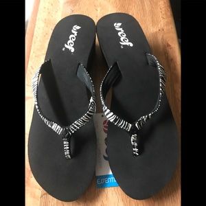 Reef black zebra sandals flip flops. Size 10